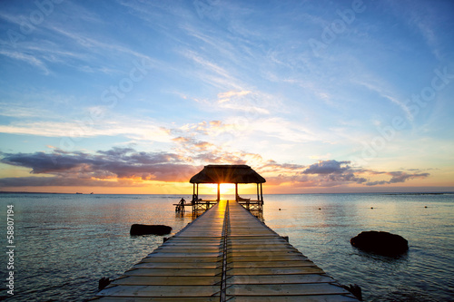 Stampe Jetty silhouette against beautiful sunset in Mauritius Island