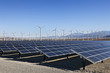 © kennytong - A View of Solar Panels and Wind Turbine in the Field