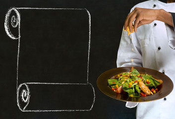 Chef holding health salad dish with chalk menu