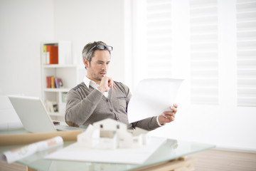 Wall Mural - architect working at his laptop on the office