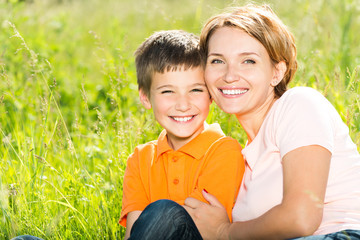 Wall Mural - Happy mother and son outdoor portrait