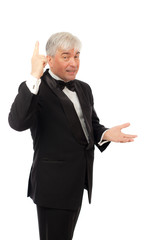 The elegant man in a tuxedo on a white background.