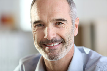 Closeup of handsome senior man with grey hair