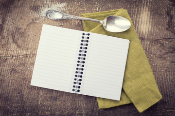 Canvas Print - Open empty notebook on wooden background