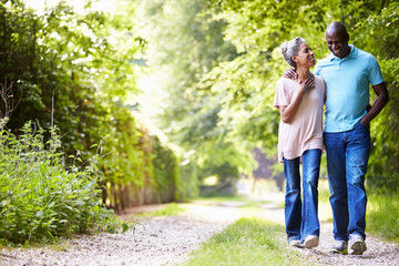 mature african american couple walking in countryside