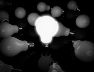 Aufkleber - Idea concept. One glowing light bulb standing in front of unlit
