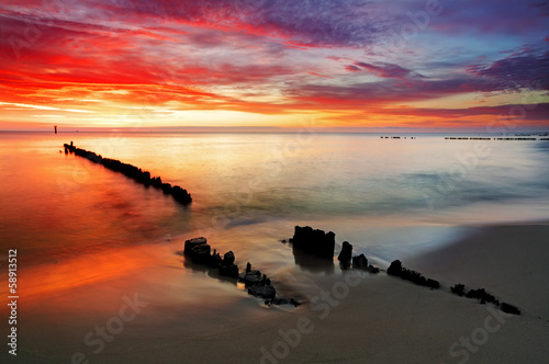 Obraz w ramie Poland, Ocean sunset on beach.