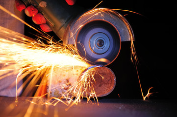 Wall Mural - Worker cutting metal with grinder