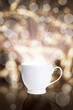 © merydolla - coffee cup against bokeh background