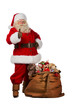 © Milles Studio - Santa Claus posing near a bag full of gifts and thumbs up