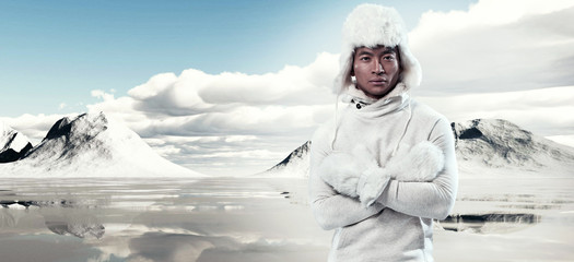 Wall Mural - Asian winter fashion man in snow mountain landscape. Wearing whi