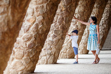 Young Mother And Her Son Walking Park Guell