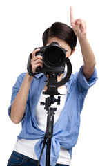 Wall Mural - Girl takes pictures holding photographic camera, isolated 