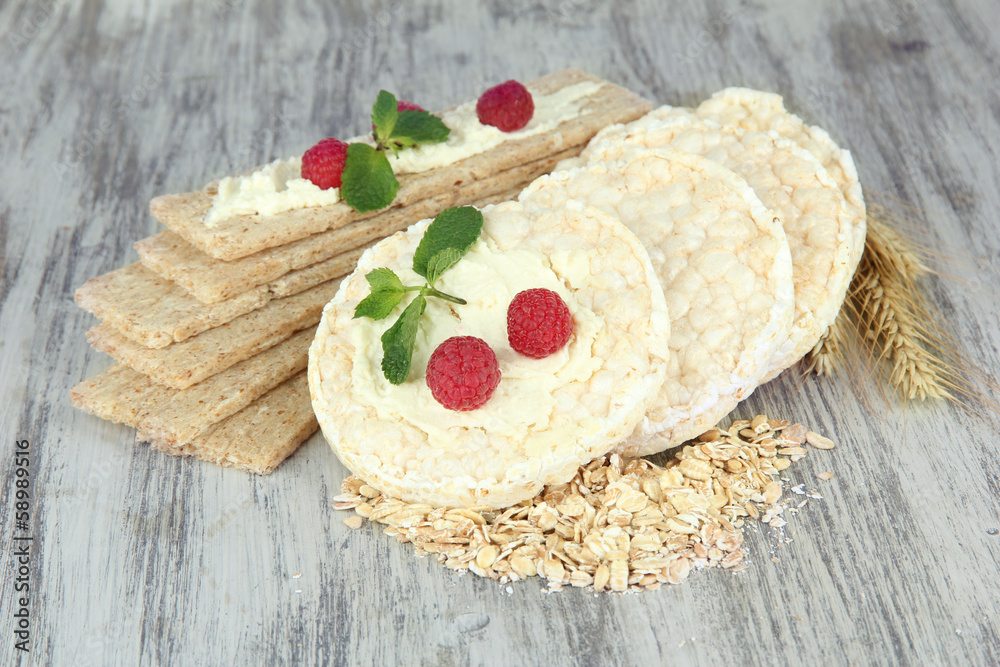 Tasty crispbread with berries, on wooden table