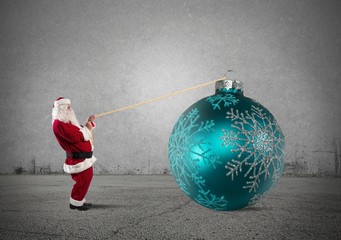 Santa Claus with big Christmas ball