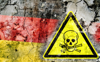 Wall Mural - Old cracked wall with poison warning sign and painted flag