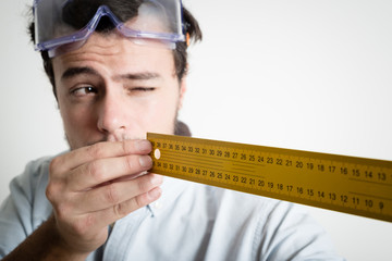 young man bricolage working measuring with meter