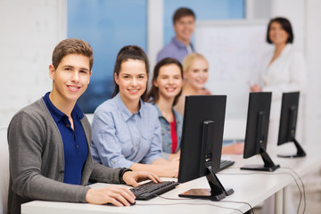 Wall Mural - students with computer monitor at school