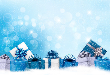 Wall Mural - Christmas blue background with gift boxes and snowflakes. Vector