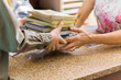 © Tyler Olson - Librarian Taking Books From Boy At Library Counter