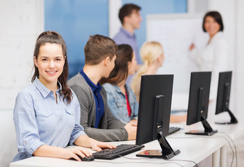 Wall Mural - students with computer monitor at school
