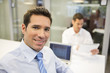 © ldprod - Portrait of smiling businessman working in office