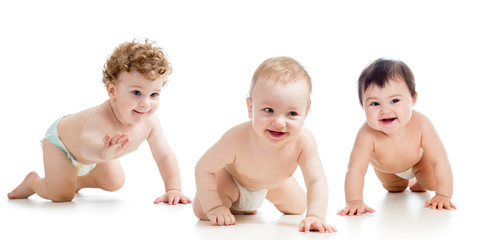 Babies group wearing diapers. Kids are crawling on floor.