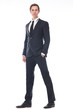 © mimagephotos - Full body portrait of a handsome young businessman in black suit