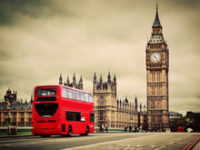 London, The UK. Red Bus In Motion And Big Ben