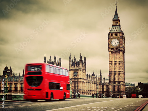 Obraz w ramie London, the UK. Red bus in motion and Big Ben