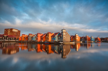 Fototapete - colorful buildings on water during sunrise, Holland