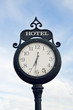 Clock with hotel sign in Victorian-style