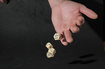 One Left Male Hand Playing Dice