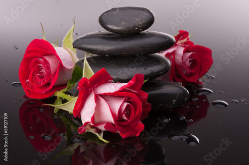 Naklejka dekoracyjna Spa stone and rose flowers still life. Healthcare concept.