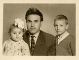 Fototapeta Młodzieżowe - father and his children, son and daughter - circa 1955