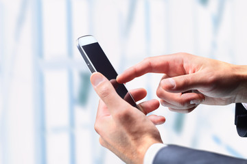 close up of a man using mobile smart phone