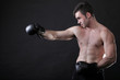© anetlanda - Portrait sportsman boxer in studio dark background