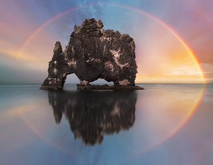 Canvas Print - Rainbow over ocean rock, Iceland