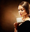 © Subbotina Anna - Coffee. Beautiful Girl Drinking Tea or Coffee