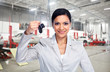 © grinny - Beautiful woman with a car key.