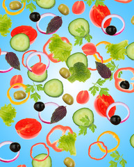 Wall Mural - Falling fresh vegetables on blue background