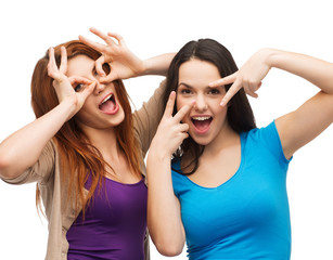 Wall Mural - two young teenagers making faces