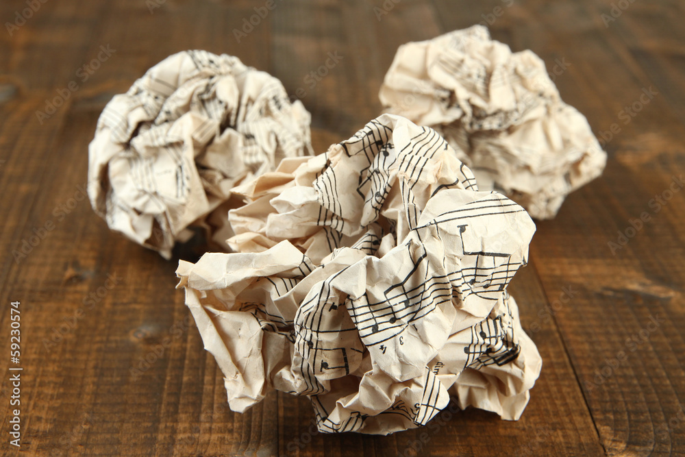 Crumpled paper balls on wooden background