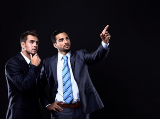 Two young businessman showing empty copyspace