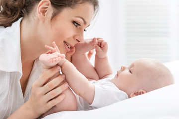 Wall Mural - Portrait of happy mother and baby