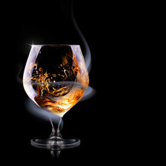 Cognac glass shrouded in a smoke