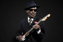 Retro Senior Afro American Blues Man. Wearing Striped Suit With