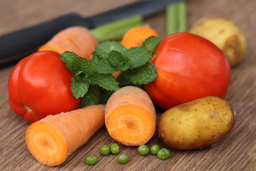 Wall Mural - Fresh vegetables on a wooden surface