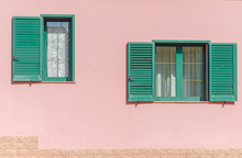 Two Window With Open Green Shutters