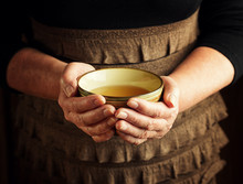 Hands Of Senior Woman Holding Cup Of Tea